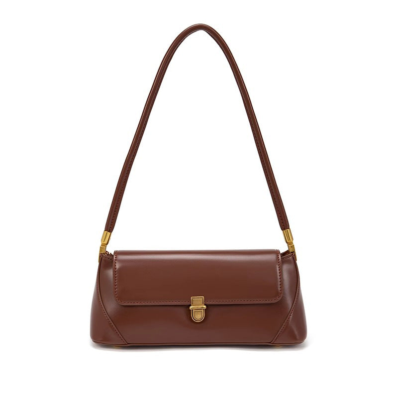 Bolsa Nicole baguette em material sintético premium, elegante e atemporal. Design clean com alça de ombro, toque macio e estrutura firme para qualquer ocasião.