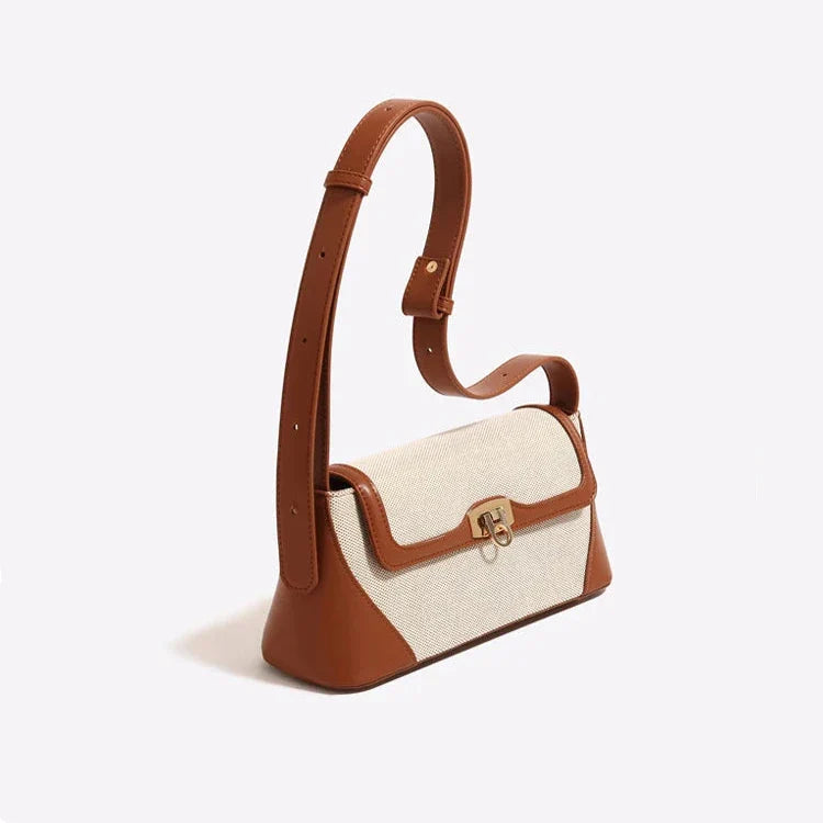 A Bolsa Isabele tem estilo baguete, elegante e funcional. Compacta por fora e espaçosa por dentro, é ideal para o verão e combina com looks casuais ou sofisticados.