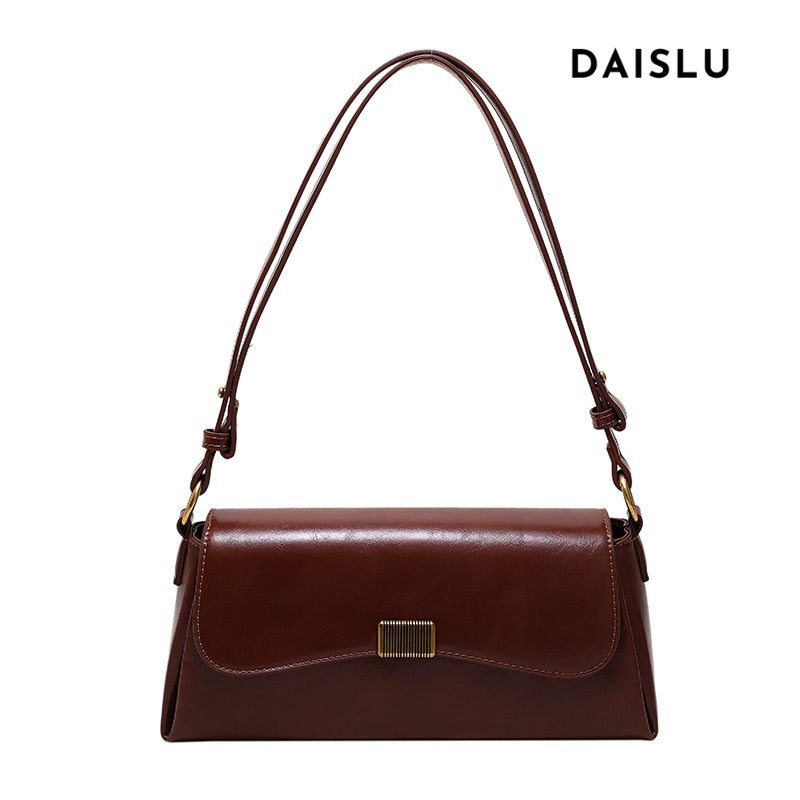 Bolsa Renata em couro legítimo, estilo baguete. Sofisticada e espaçosa, com zíper e botão magnético, perfeita para looks elegantes e versáteis do dia a dia.