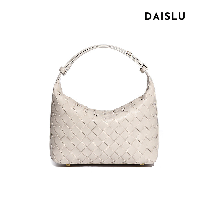 Bolsa Cleo com trama artesanal em material premium. Sofisticada, durável e elegante, com acabamento impecável e metais que destacam seu design exclusivo.