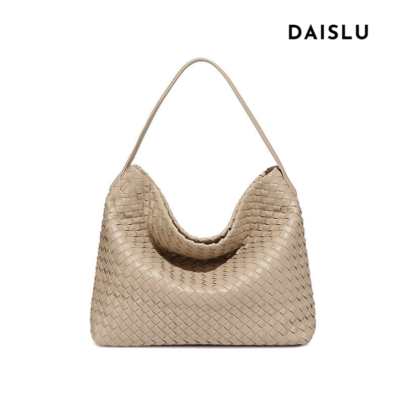 Bolsa Sara trançada, moderna e espaçosa, ideal para o verão. Sofisticada e prática, acomoda tudo com estilo nos dias quentes e agitados.