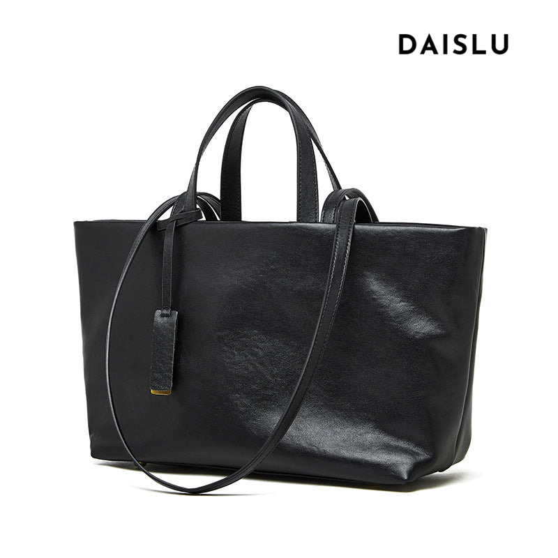 Bolsa Jéssica em couro legítimo, elegante e funcional. Design minimalista, espaçosa e com divisórias ideais para trabalho, viagens ou o dia a dia.