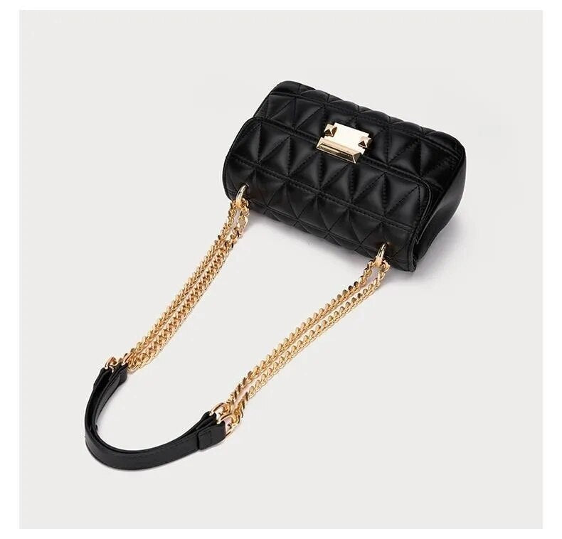 Bolsa Júlia com design estruturado e matelassê. Sofisticada e prática, feita em material sintético durável, ideal para o dia a dia ou ocasiões especiais.