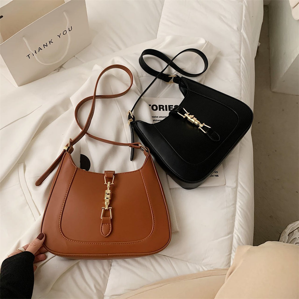 Bolsa Louise em material sintético com toque de couro, compacta e elegante. Espaçosa, prática e ideal para o dia a dia com estilo e sofisticação.