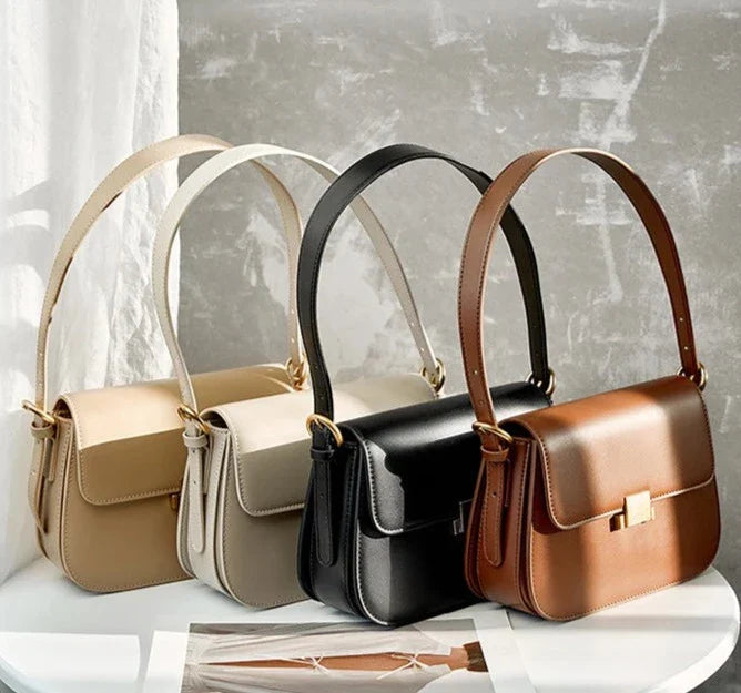 Bolsa Samira em couro legítimo, compacta e elegante. Modelo box bag com bolsos internos, ideal para mulheres que buscam estilo e praticidade no dia a dia.