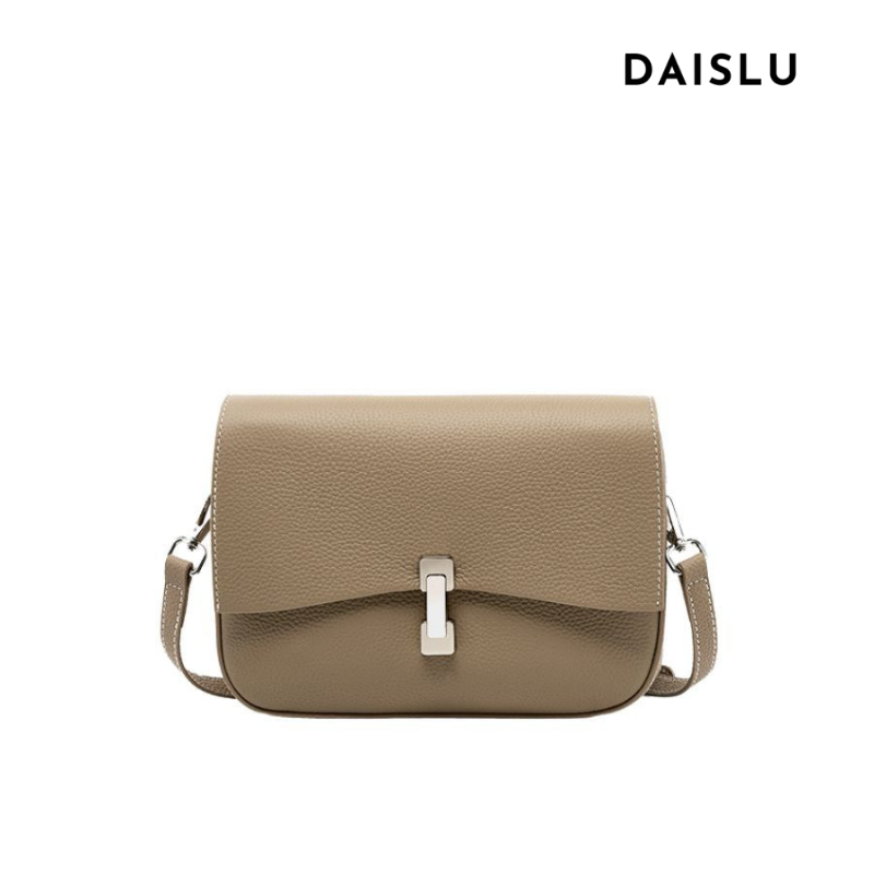 Bolsa Bruna em couro legítimo, compacta, elegante e durável. Modelo transversal com divisórias internas para manter seus itens organizados com estilo.