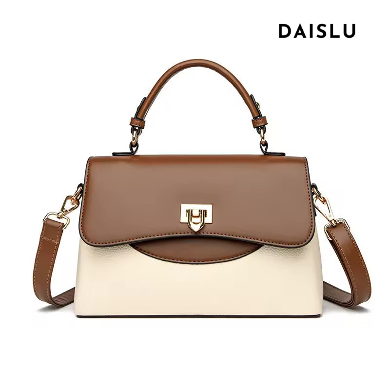 Bolsa Joana média, elegante e funcional. Design versátil com alças confortáveis e linhas suaves, ideal para o dia a dia ou eventos com estilo e praticidade.