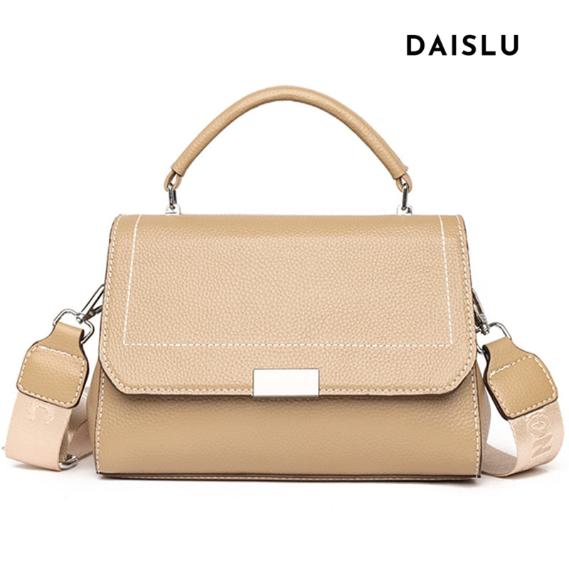 Bolsa Laura em couro legítimo, compacta, elegante e versátil. Com alça ajustável, zíper, botão magnético e divisórias para praticidade no dia a dia.