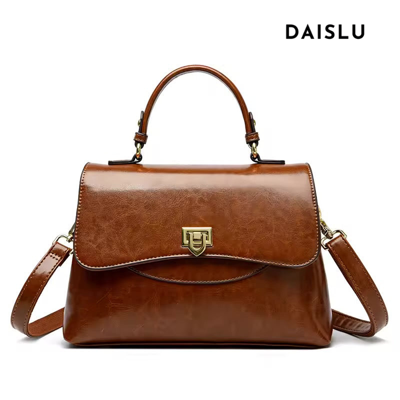 Bolsa Luara média, elegante e versátil, com design atemporal. Alças confortáveis e estrutura sofisticada, ideal para o dia a dia e ocasiões especiais.