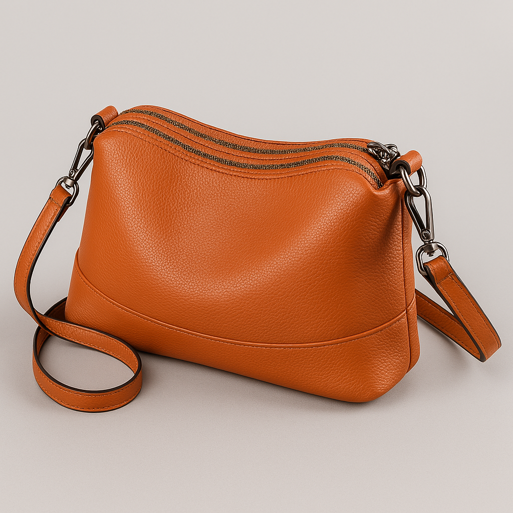 Bolsa Pietra em couro legítimo, compacta, elegante e resistente. Alça ajustável, zíper seguro e ótimo espaço interno para o dia a dia com estilo.