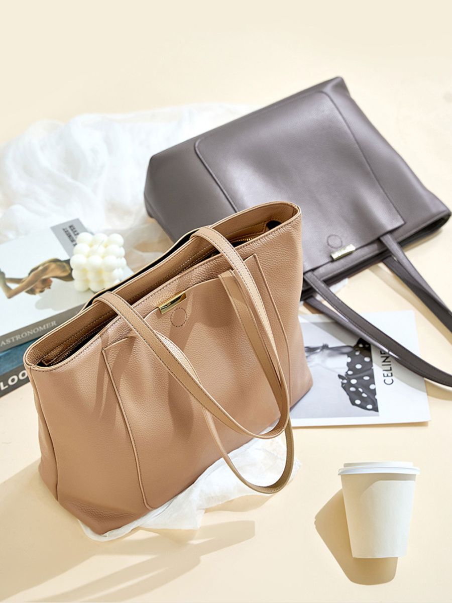 Bolsa Laís em couro legítimo, tote moderna e elegante. Espaçosa, com divisórias, bolsos externos e zíper para praticidade e estilo no dia a dia.