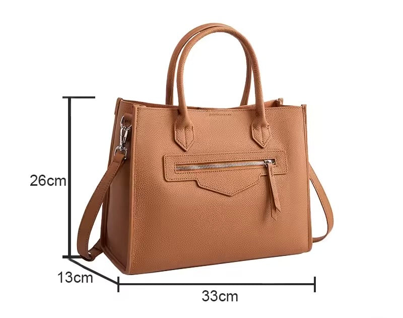 Bolsa Olívia em couro legítimo, tote grande e elegante. Espaçosa, com divisórias, fecho duplo e alças para usar na mão ou no modelo transversal.