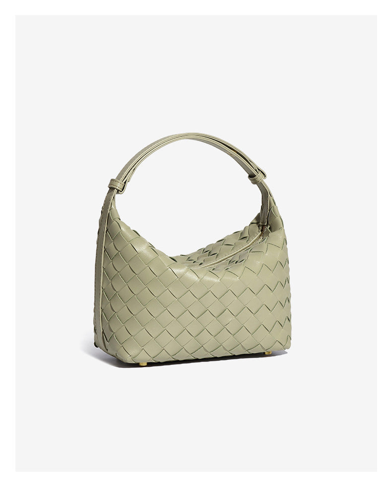 Bolsa Cleo com trama artesanal em material premium. Sofisticada, durável e elegante, com acabamento impecável e metais que destacam seu design exclusivo.