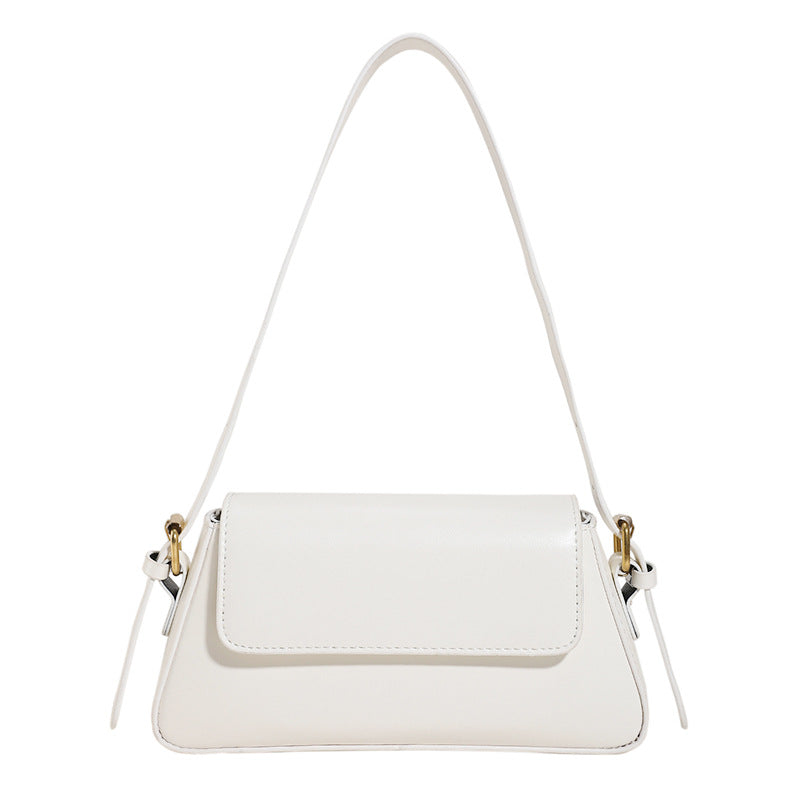 Bolsa Mila baguete em material sintético premium, elegante e moderna. Design estruturado, textura delicada e alça de ombro para looks versáteis.