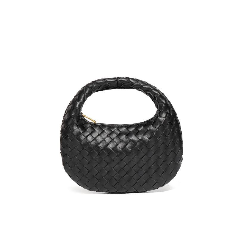 Bolsa Samile estilo baguete com trama trançada à mão. Elegante, moderna e exclusiva, é perfeita para mulheres que valorizam estilo e acabamento impecável.