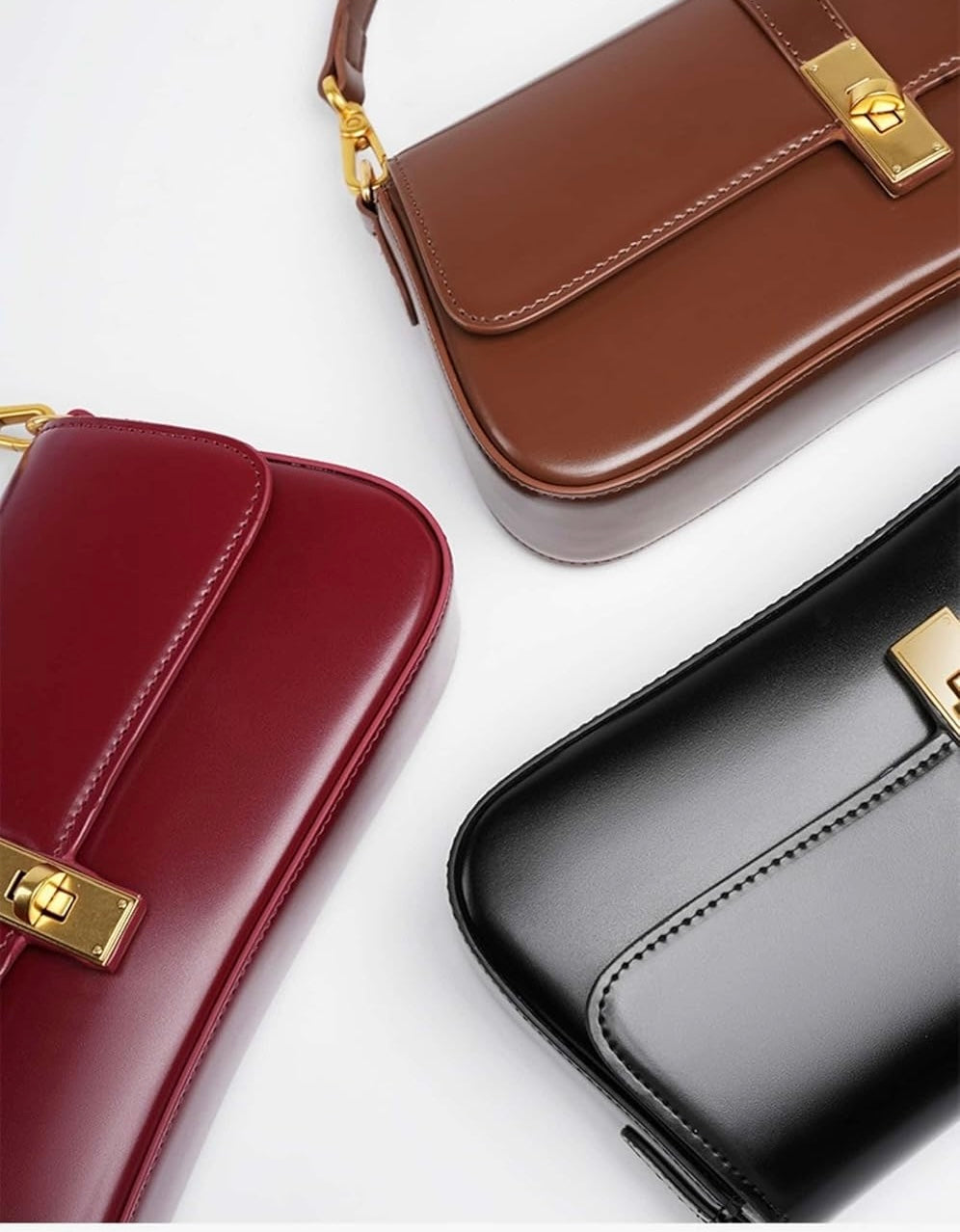 Bolsa Ana em couro legítimo, estilo baguette. Compacta, elegante e resistente, com divisórias internas que garantem praticidade e organização no dia a dia.