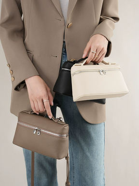 Bolsa Lorena em couro legítimo, compacta, elegante e durável. Design clássico com compartimentos internos, ideal para o dia a dia ou eventos especiais.
