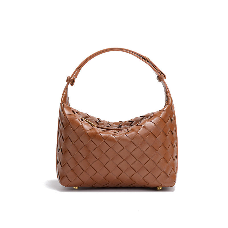 Bolsa Cleo com trama artesanal em material premium. Sofisticada, durável e elegante, com acabamento impecável e metais que destacam seu design exclusivo.