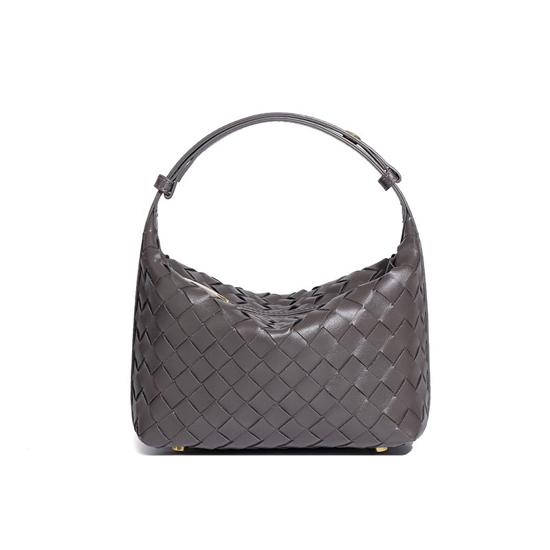 Bolsa Cleo com trama artesanal em material premium. Sofisticada, durável e elegante, com acabamento impecável e metais que destacam seu design exclusivo.