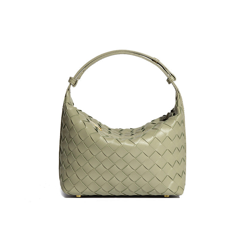 Bolsa Cleo com trama artesanal em material premium. Sofisticada, durável e elegante, com acabamento impecável e metais que destacam seu design exclusivo.