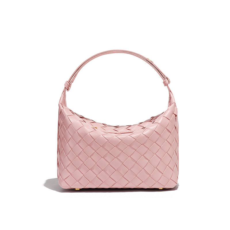 Bolsa Cleo com trama artesanal em material premium. Sofisticada, durável e elegante, com acabamento impecável e metais que destacam seu design exclusivo.