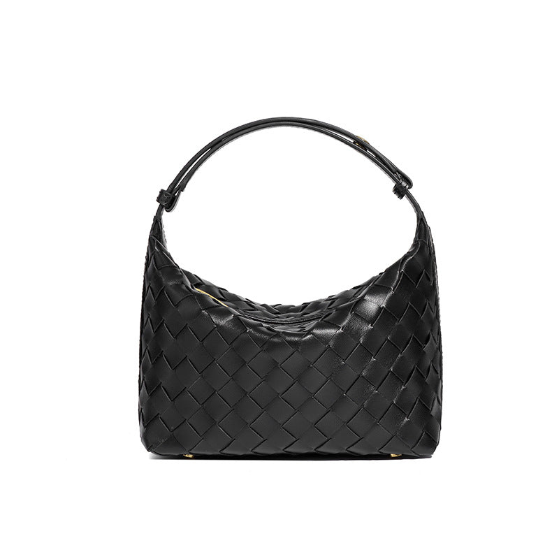 Bolsa Cleo com trama artesanal em material premium. Sofisticada, durável e elegante, com acabamento impecável e metais que destacam seu design exclusivo.