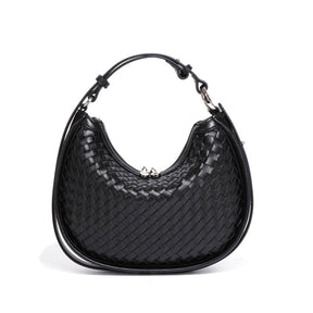 Bolsa Eloá em material sintético premium com trama artesanal. Elegante e atemporal, tem acabamento impecável e metais zamak que garantem brilho e durabilidade.
