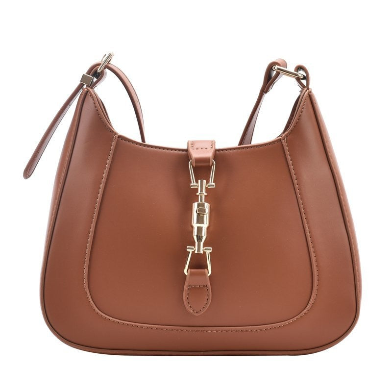 Bolsa Louise em material sintético com toque de couro, compacta e elegante. Espaçosa, prática e ideal para o dia a dia com estilo e sofisticação.