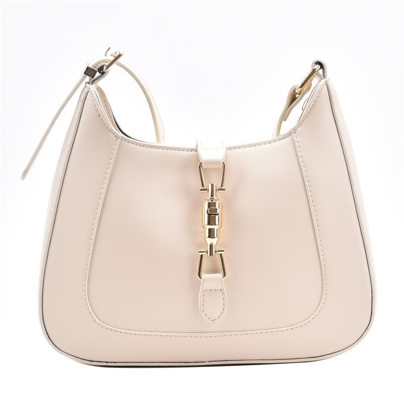 Bolsa Louise em material sintético com toque de couro, compacta e elegante. Espaçosa, prática e ideal para o dia a dia com estilo e sofisticação.