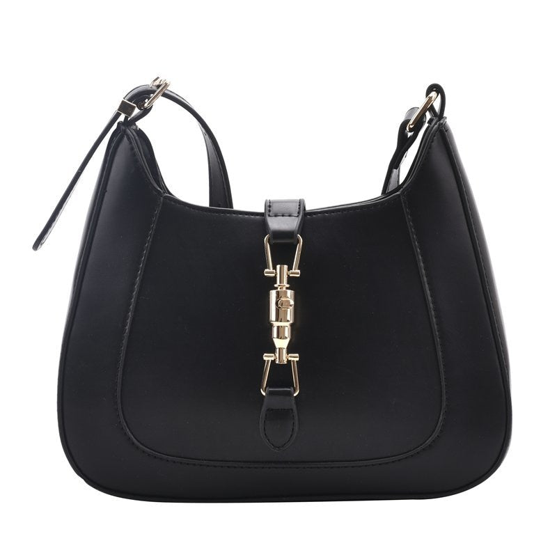 Bolsa Louise em material sintético com toque de couro, compacta e elegante. Espaçosa, prática e ideal para o dia a dia com estilo e sofisticação.