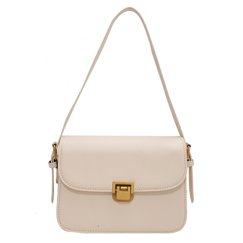 Bolsa Rebeca com textura em couro, compacta, elegante e versátil. Ideal para o dia a dia, com ótimo espaço interno para itens essenciais.