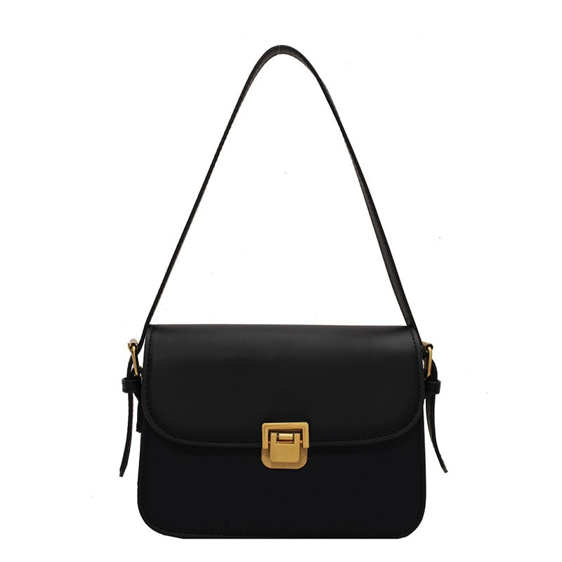 Bolsa Rebeca com textura em couro, compacta, elegante e versátil. Ideal para o dia a dia, com ótimo espaço interno para itens essenciais.