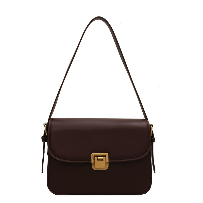Bolsa Rebeca com textura em couro, compacta, elegante e versátil. Ideal para o dia a dia, com ótimo espaço interno para itens essenciais.