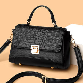Bolsa Kelly média, elegante e funcional, com alças confortáveis e design clássico. Versátil e sofisticada, ideal para o dia a dia ou ocasiões especiais.