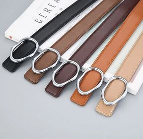 Cinto Eloá em couro legítimo com fivela metálica assimétrica. Sofisticado, durável e versátil, ideal para looks casuais ou formais com toque moderno.