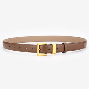 Cinto Ísis em couro legítimo com fivela dourada. Elegante, durável e versátil, ideal para looks casuais ou formais. Disponível em diversas cores.