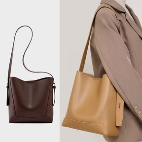 Bolsa Antonela estilo bucket em couro legítimo, elegante e atemporal. Funcional, com ferragens prata e design sofisticado para o dia a dia ou eventos.