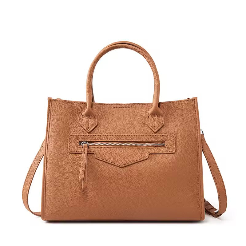 Bolsa Olívia em couro legítimo, tote grande e elegante. Espaçosa, com divisórias, fecho duplo e alças para usar na mão ou no modelo transversal.