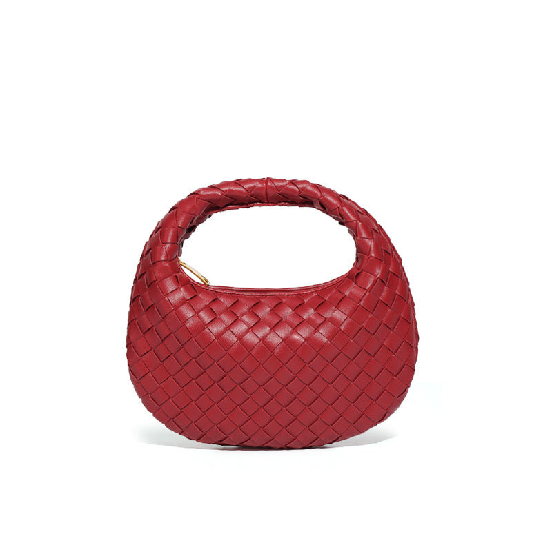 Bolsa Samile estilo baguete com trama trançada à mão. Elegante, moderna e exclusiva, é perfeita para mulheres que valorizam estilo e acabamento impecável.